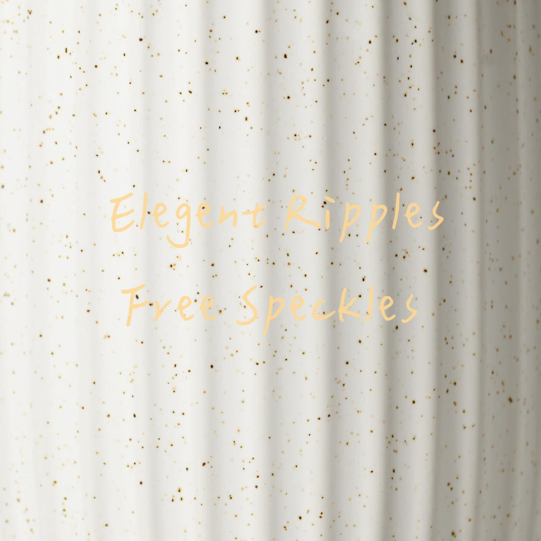 Close-up of the rippled white ceramic surface with fine gold speckles
