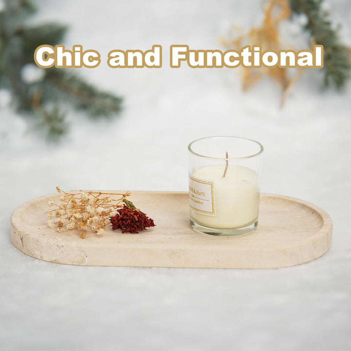Travertine tray with a candle and dried flowers on a soft white surface