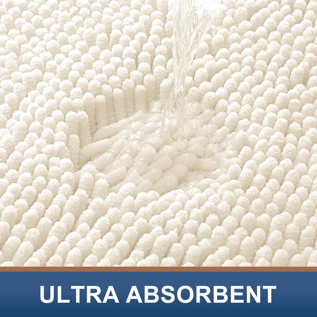 Water poured onto the ivory chenille pile of the Smiry bath mat to show absorbency