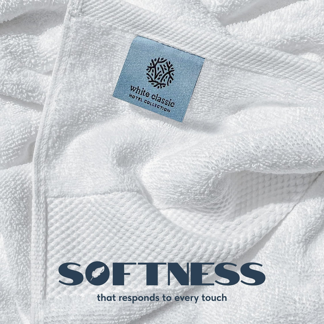 Close-up of white cotton terry loops and woven border with a White Classic Hotel Collection label