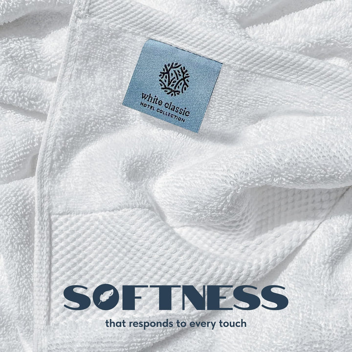 Close-up of white cotton terry loops and woven border with a White Classic Hotel Collection label