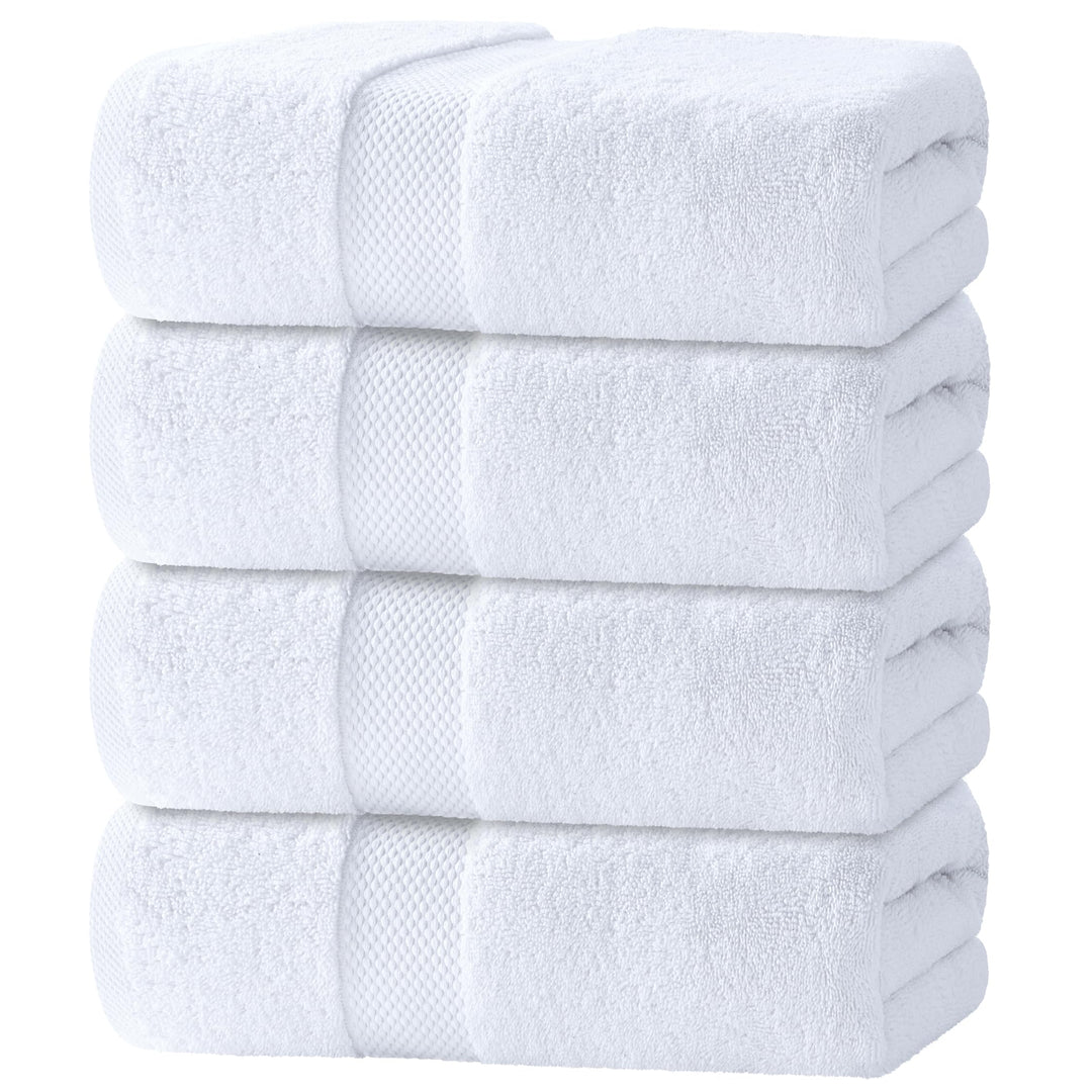 Stack of four folded white cotton bath towels with a woven border band