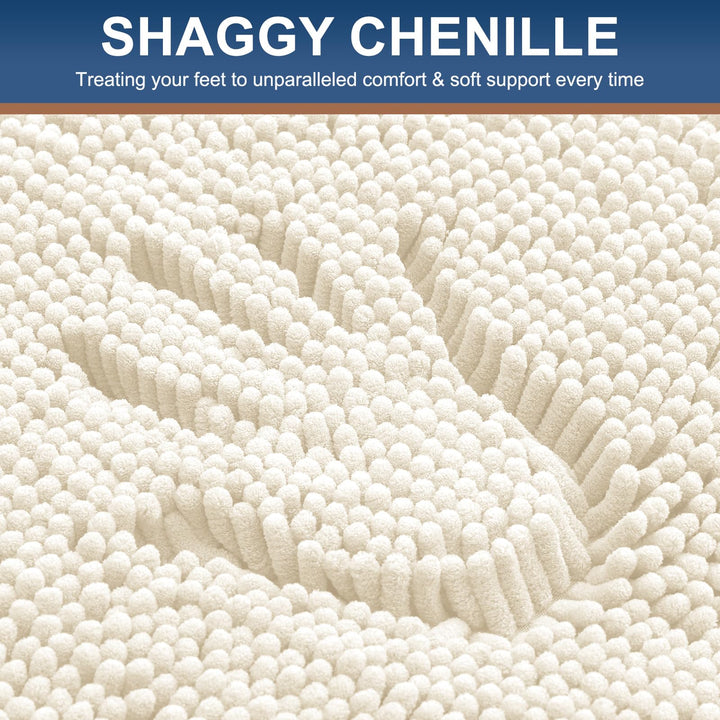 Close-up of a hand pressed into the ivory shaggy chenille pile of the Smiry bath mat