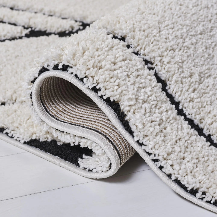 SAFAVIEH Area Rug 8x10, Florida Shag Collection, Ivory &amp; Black