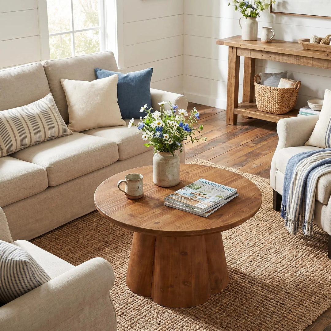TRIBEWOOD round solid wood coffee table with a four-petal base